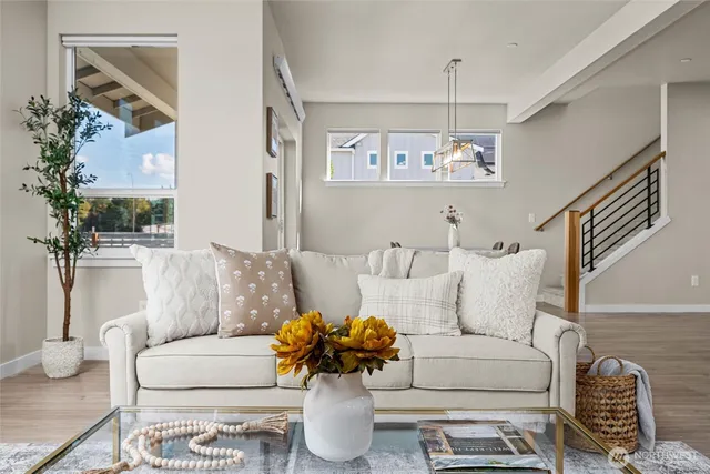 a living room with furniture and a table