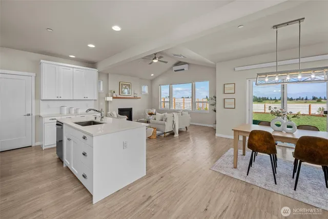 a kitchen with stainless steel appliances granite countertop a sink and a stove top oven