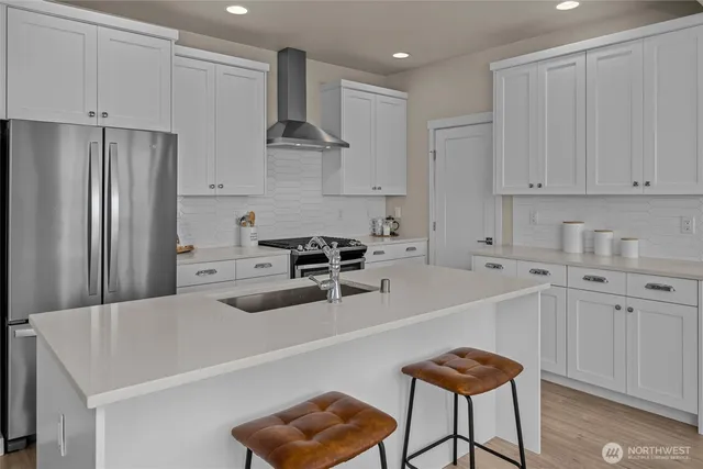 a living room with a table chairs and a window