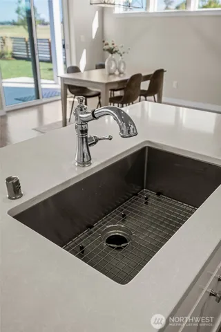 a stove top oven sitting inside of a kitchen