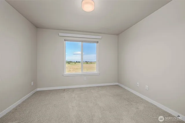 an empty room with closet area