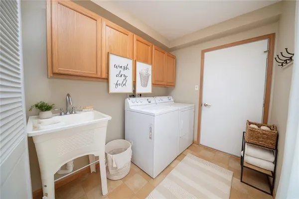 a bathroom with a sink toilet and a mirror