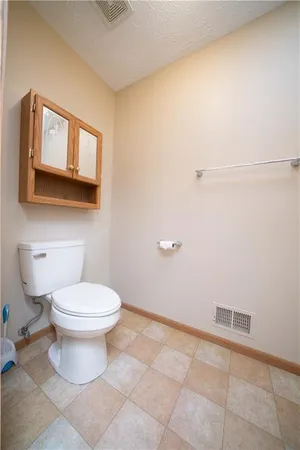 a spacious bathroom with a mirror sink and