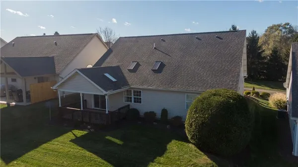 an aerial view of a house having yard