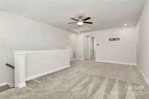 a view of a white house with a outdoor space