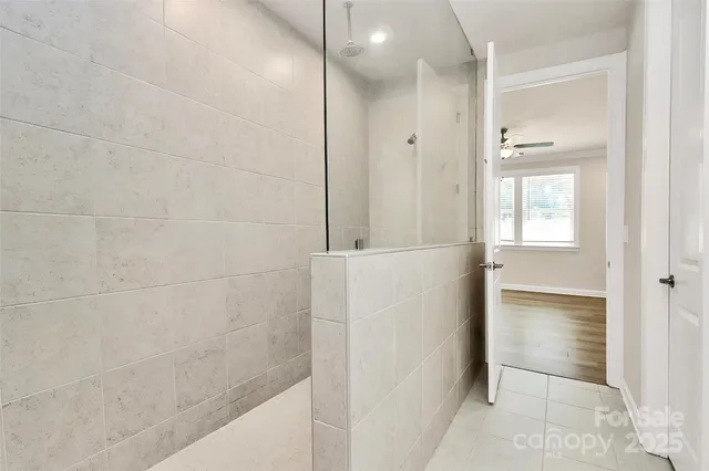 a bathroom with a bathtub and a shower