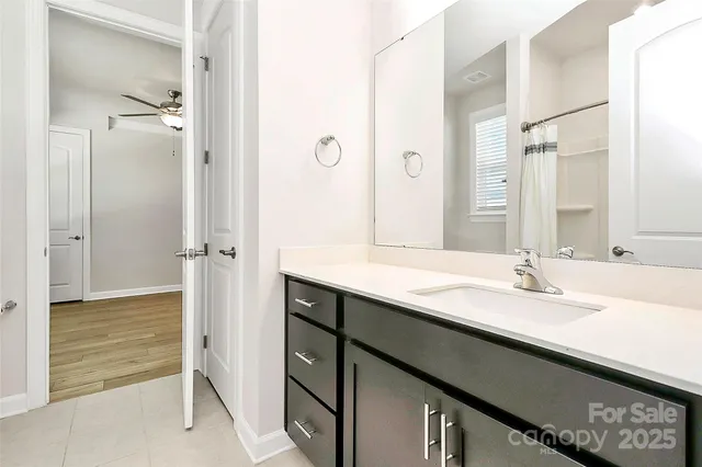 a view of an empty room and wooden floor