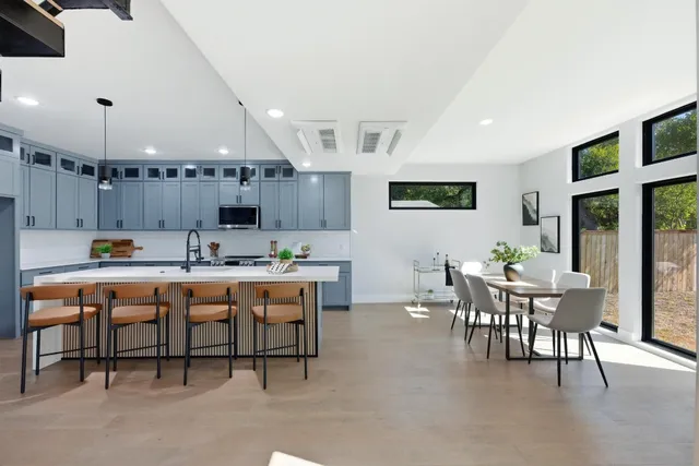 a kitchen with a table and chairs in it