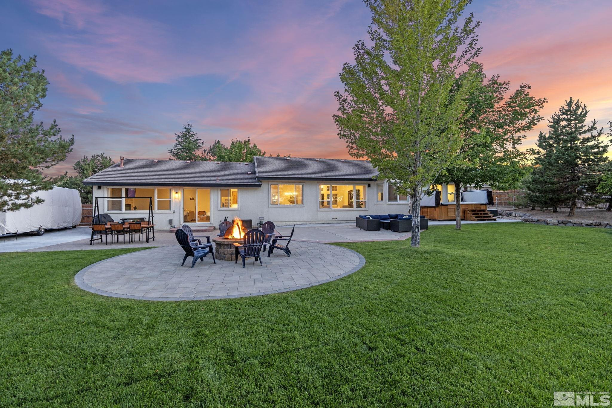 615 Flanders Road Reno, NV 89511 - Photo 3 of 39 a garden view with a seating space and fir pit