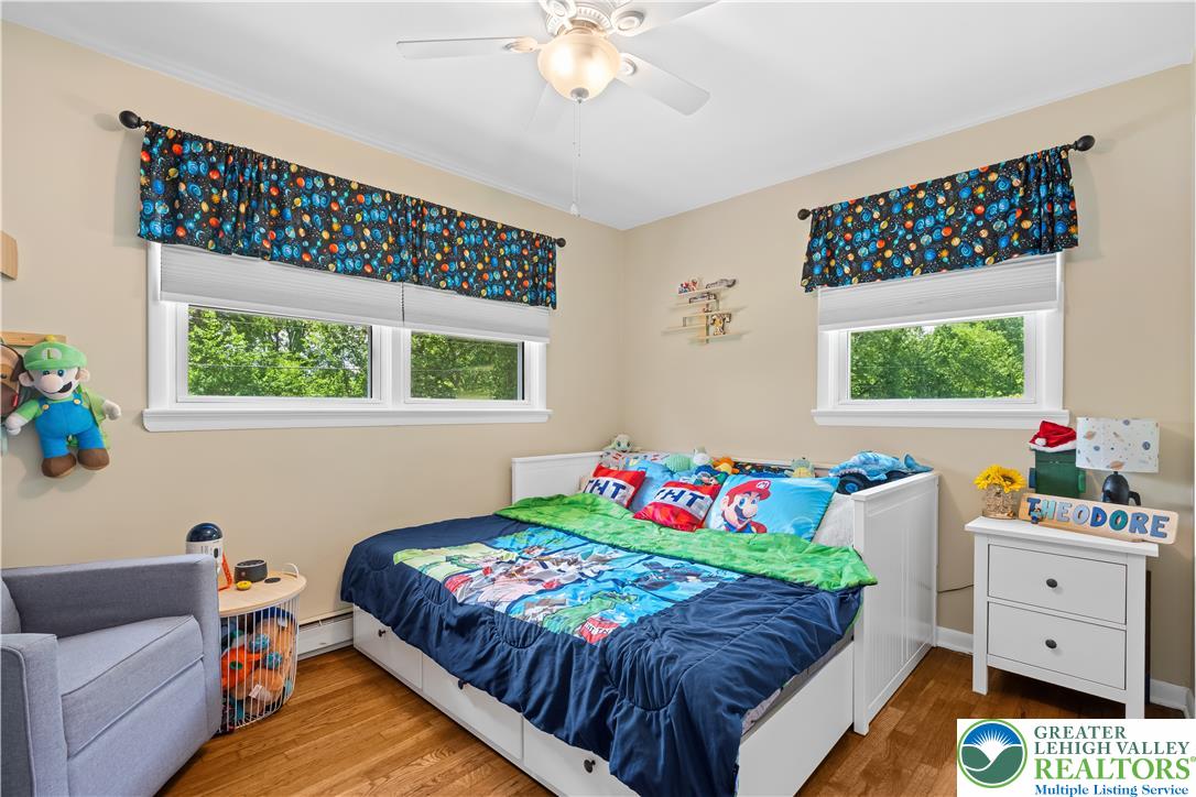 50 Kohls Road Northampton, PA 18067 - Photo 21 of 54 Hardwood floors and bright windows create a cheerful atmosphere in this comfortable bedroom.