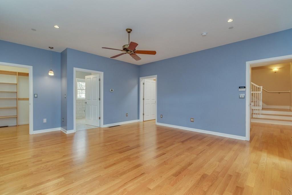197 Dow Road Hollis, NH 03049 - Photo 14 of 38 a view of an empty room with wooden floor and windows