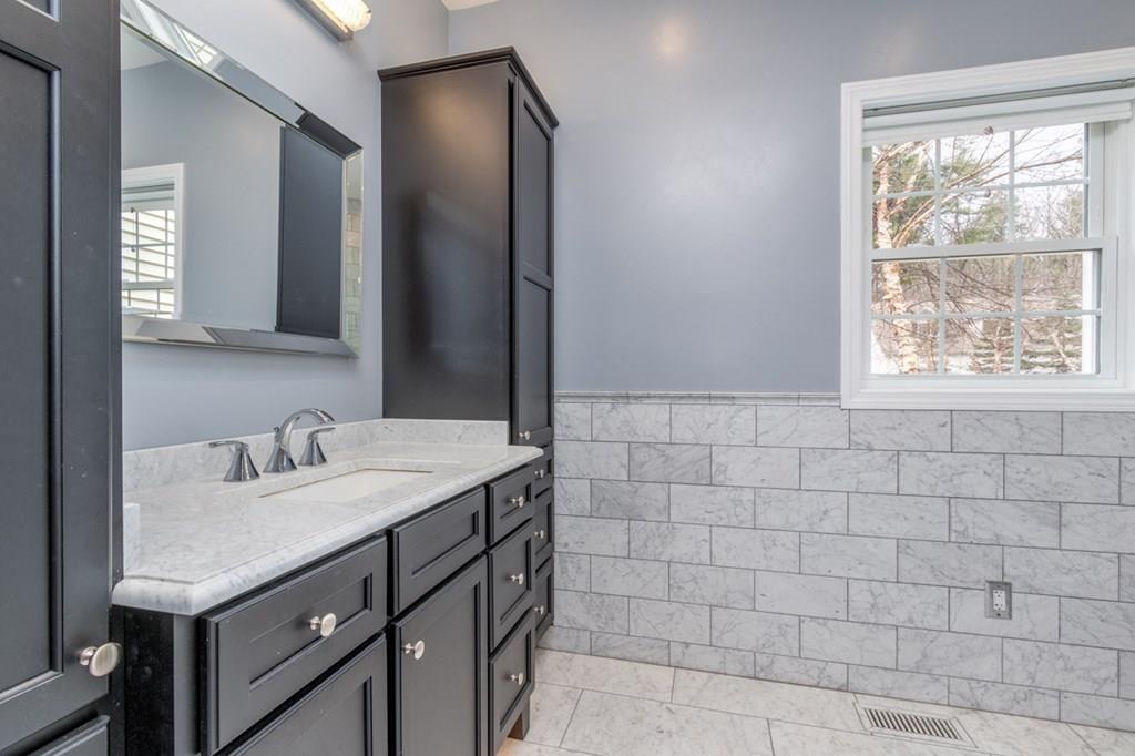 197 Dow Road Hollis, NH 03049 - Photo 15 of 38 a bathroom with a sink and a mirror