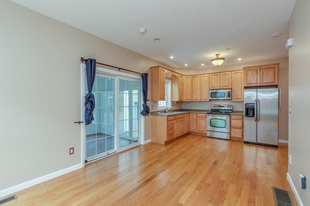 197 Dow Road Hollis, NH 03049 - Photo 24 of 38 a kitchen with stainless steel appliances granite countertop a refrigerator and a sink