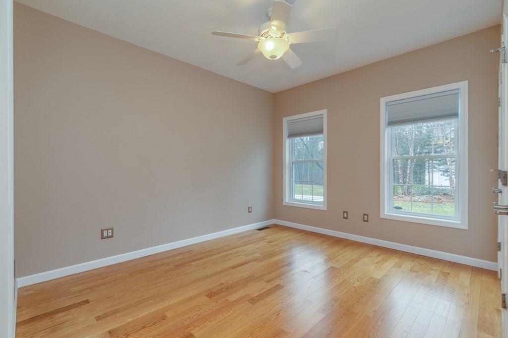 197 Dow Road Hollis, NH 03049 - Photo 26 of 38 an empty room with wooden floor and windows