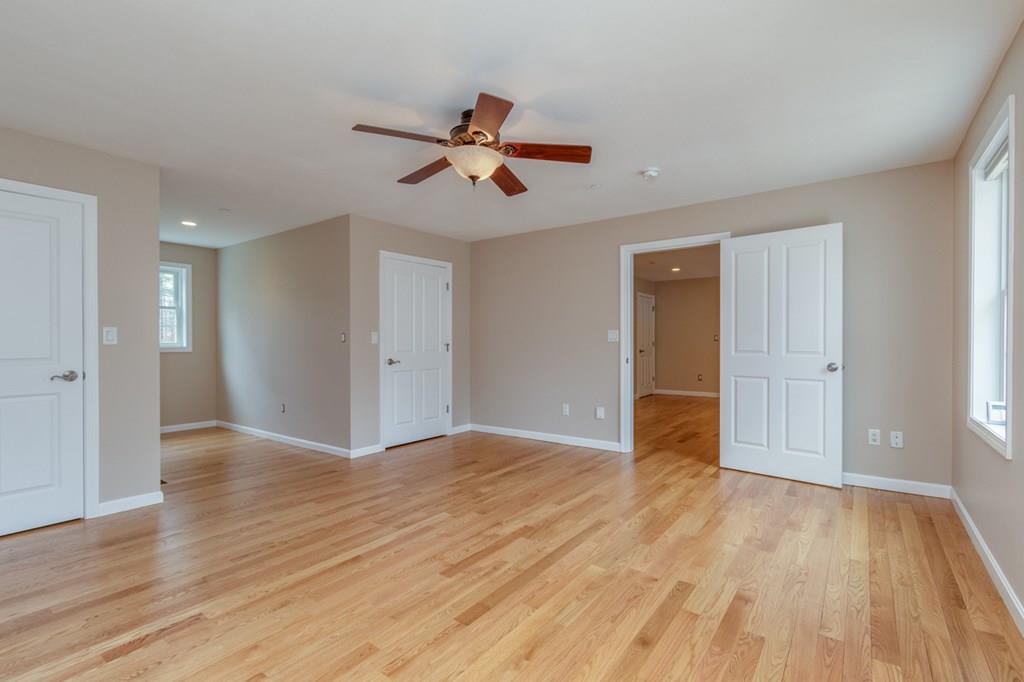197 Dow Road Hollis, NH 03049 - Photo 32 of 38 a view of an empty room with wooden floor and a window