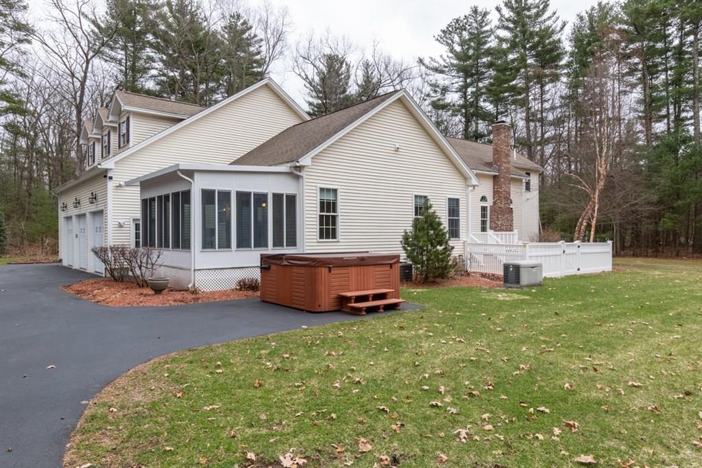 197 Dow Road Hollis, NH 03049 - Photo 35 of 38 a front view of a house with a yard and fence