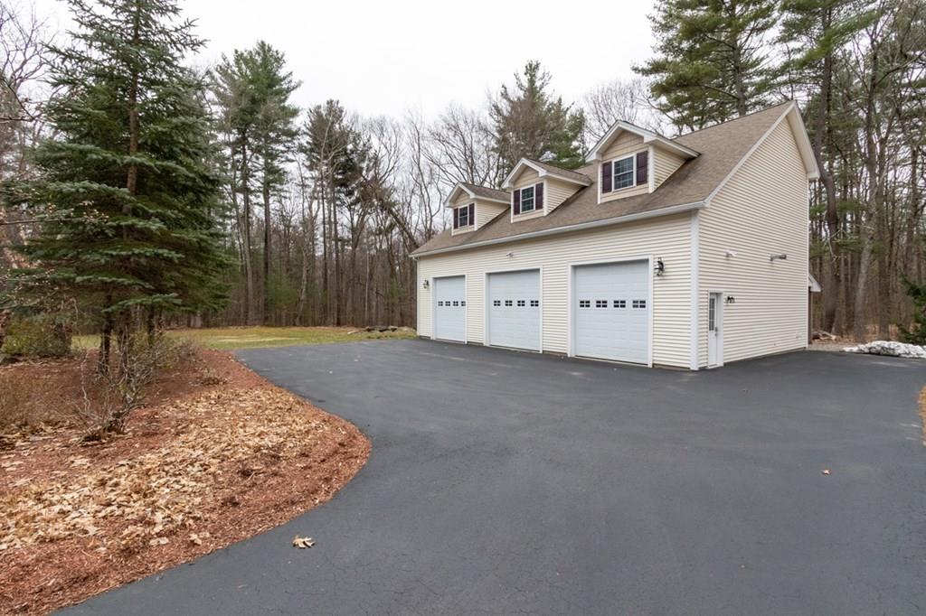 197 Dow Road Hollis, NH 03049 - Photo 36 of 38 a view of a house with a garage