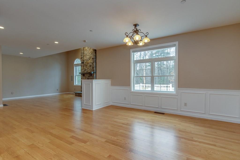 197 Dow Road Hollis, NH 03049 - Photo 10 of 38 a view of livingroom and hall with wooden floor