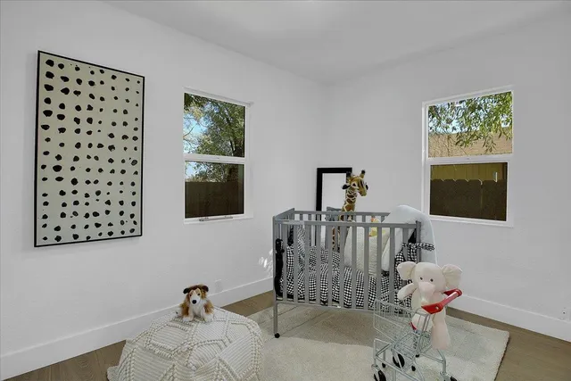 a view of hallway with wooden floor