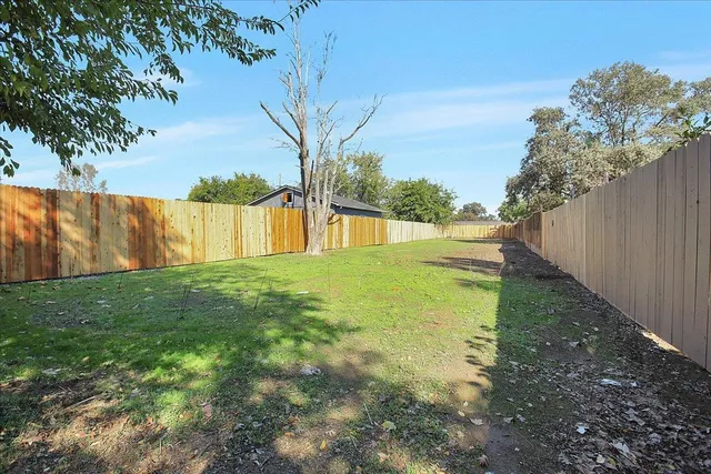a backyard of a house with lots of green space