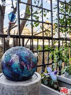 a view of a porch with a dining table and chairs