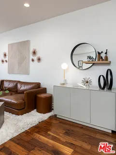 a living room with a couch and cabinets