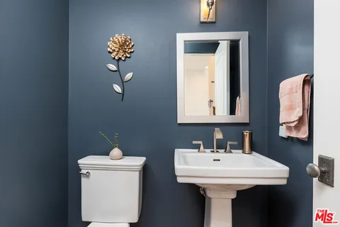 a bathroom with a sink and mirror