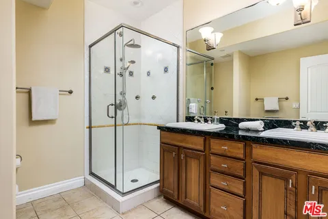 a bath room with a sink and a mirror