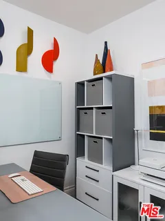 a bed room with a bed and a television