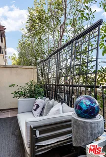a view of a chairs and table in the terrace