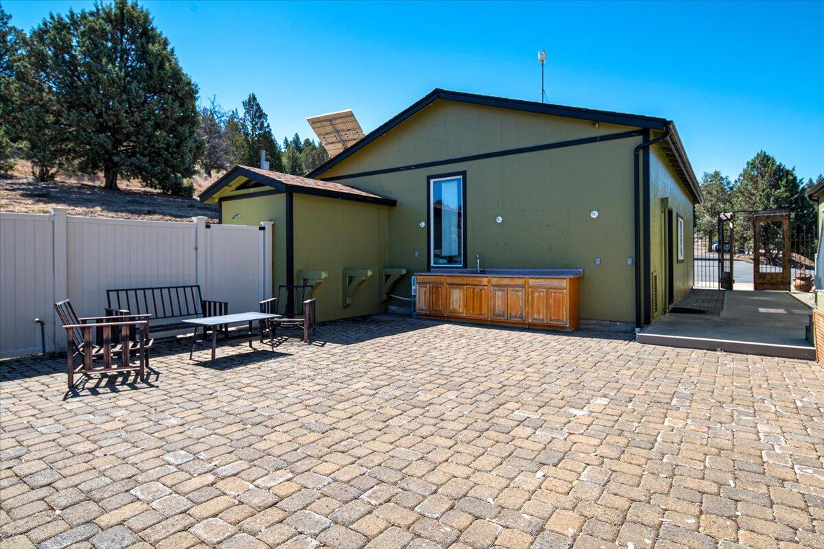 11182 Southwest Dynamite Lane Culver, OR 97734 - Photo 12 of 70 a backyard of a house with seating space
