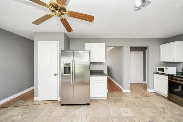 a kitchen with stainless steel appliances granite countertop a stove and a sink