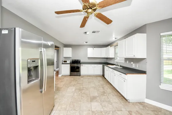 a view of a hallway with washer and dryer