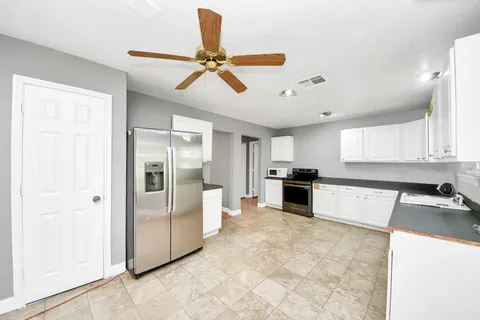 a view of a hallway with washer and dryer