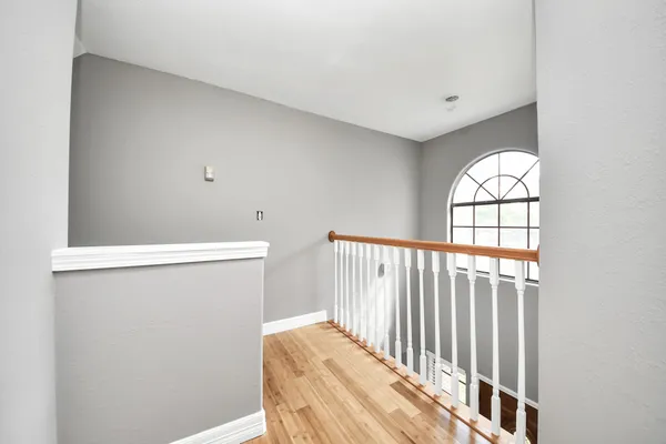 a spacious bathroom with a bathtub sink and mirror