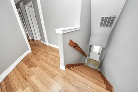 a spacious bathroom with a bathtub sink and mirror