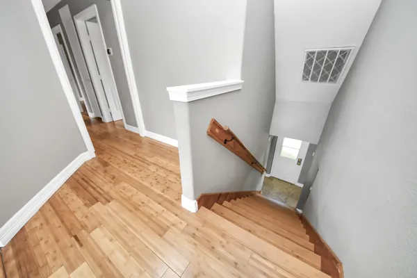 a spacious bathroom with a double vanity sink and a mirror