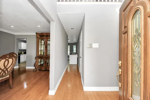 a spacious bathroom with a double vanity sink and a mirror