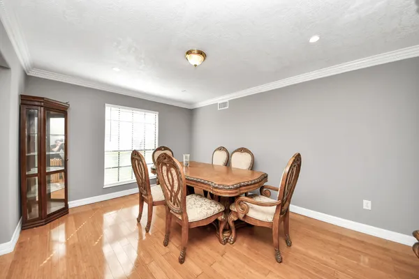 a spacious bedroom with a bed and window
