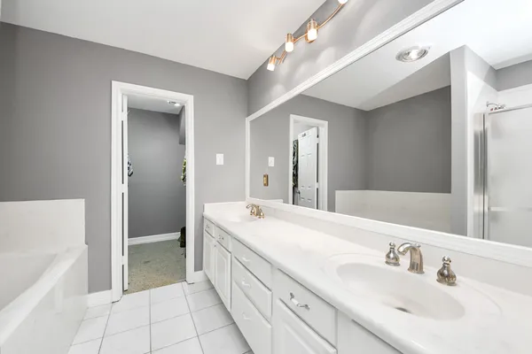 a bathroom with a bathtub and a shower