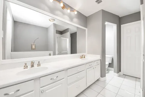 a view of grassy field with benches