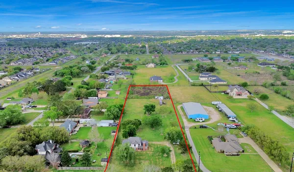 a view of a house with a big yard
