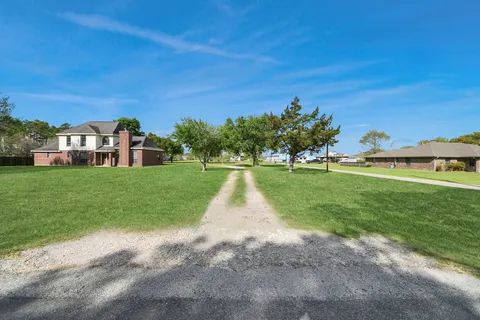 a view of a house with a big yard