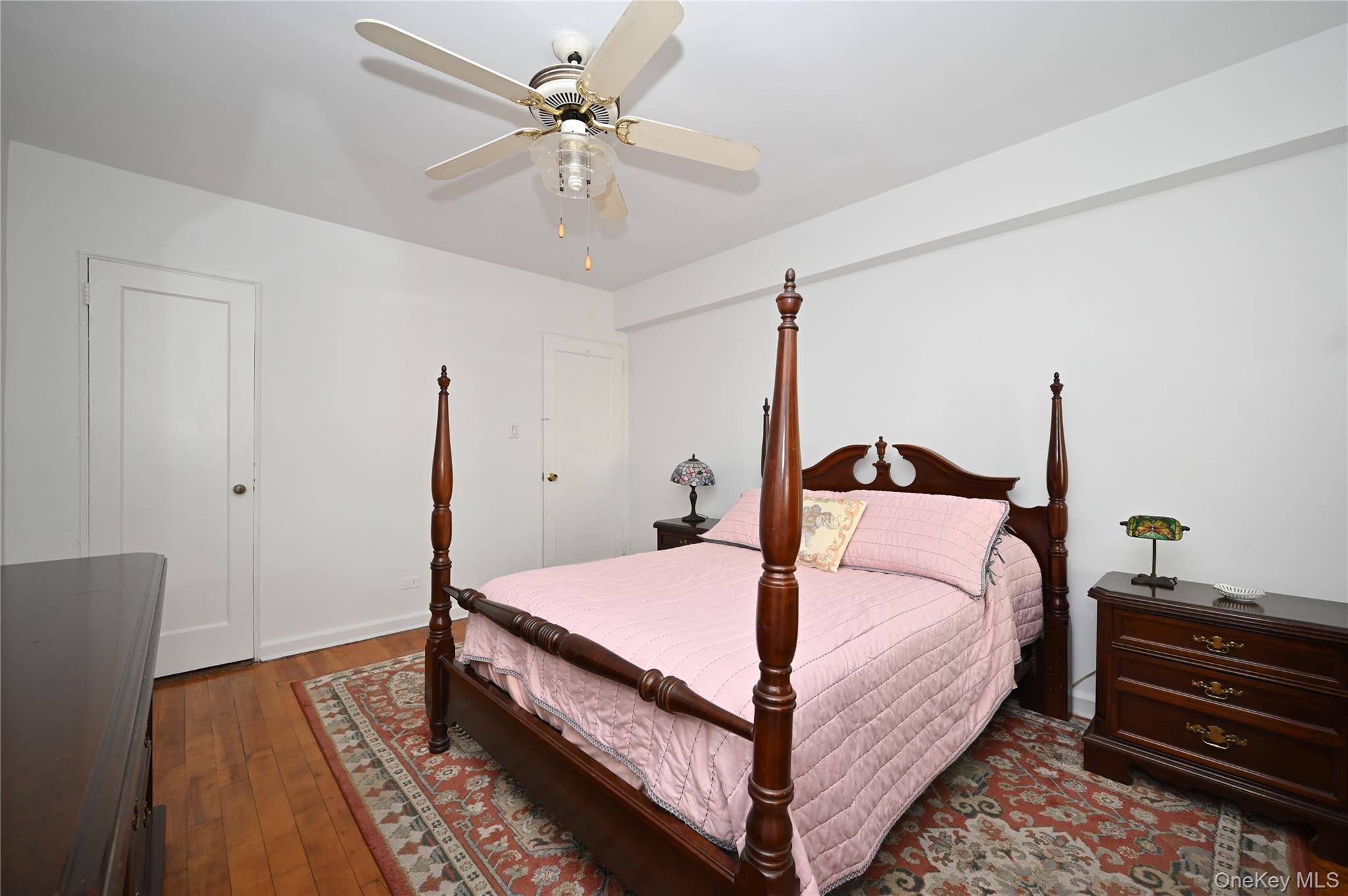 39-45 51st Street, Unit 1D Queens, NY 11377 - Photo 11 of 16 Bedroom featuring dark wood-style flooring and ceiling fan