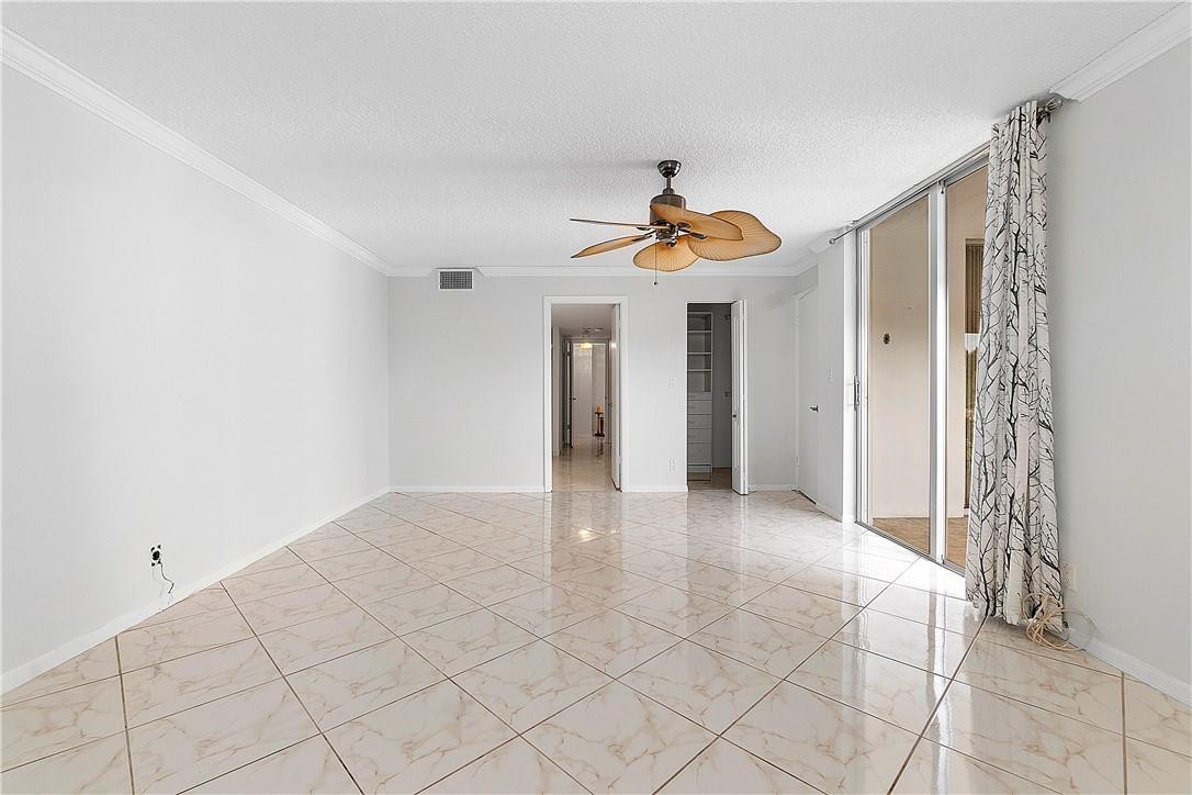 6100 Northwest 2nd Avenue, Unit 321 Boca Raton, FL 33487 - Photo 17 of 27 a view of an empty room and chandelier fan