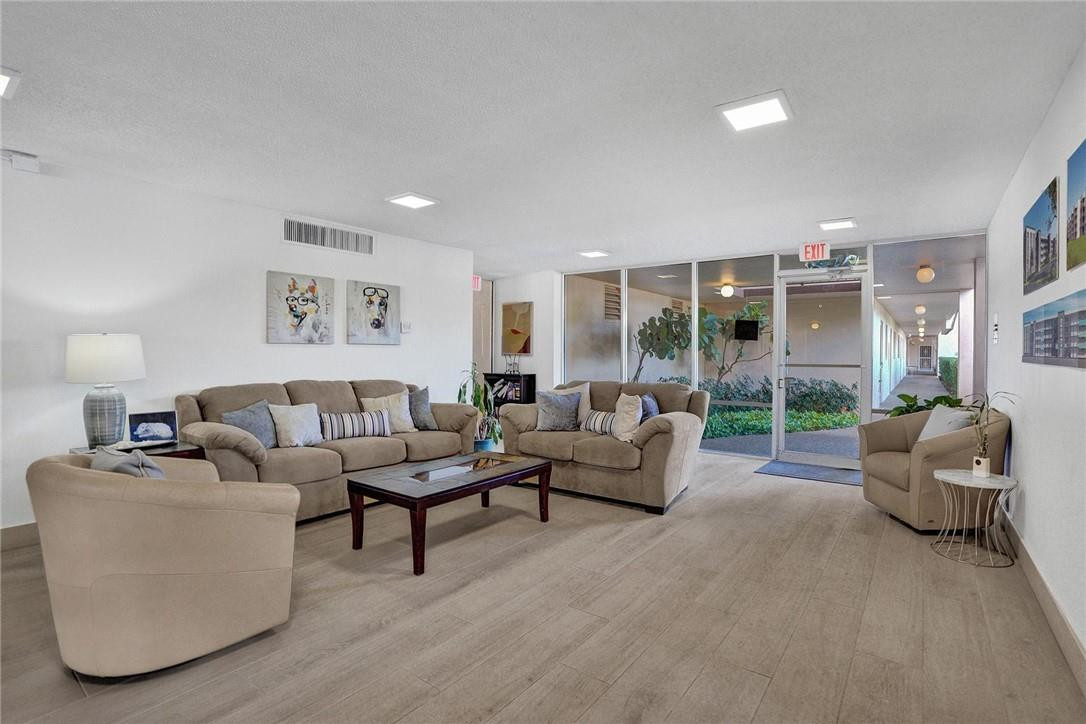 6100 Northwest 2nd Avenue, Unit 321 Boca Raton, FL 33487 - Photo 2 of 27 a living room with furniture and a large window