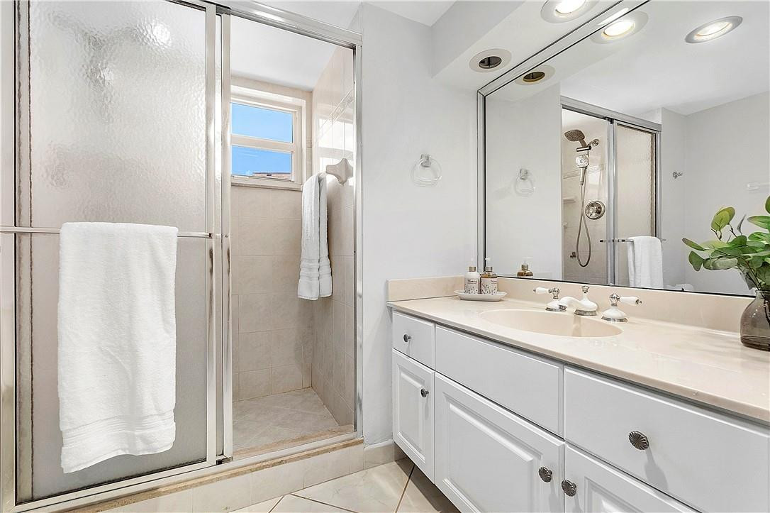 6100 Northwest 2nd Avenue, Unit 321 Boca Raton, FL 33487 - Photo 24 of 27 a bathroom with a shower sink and mirror