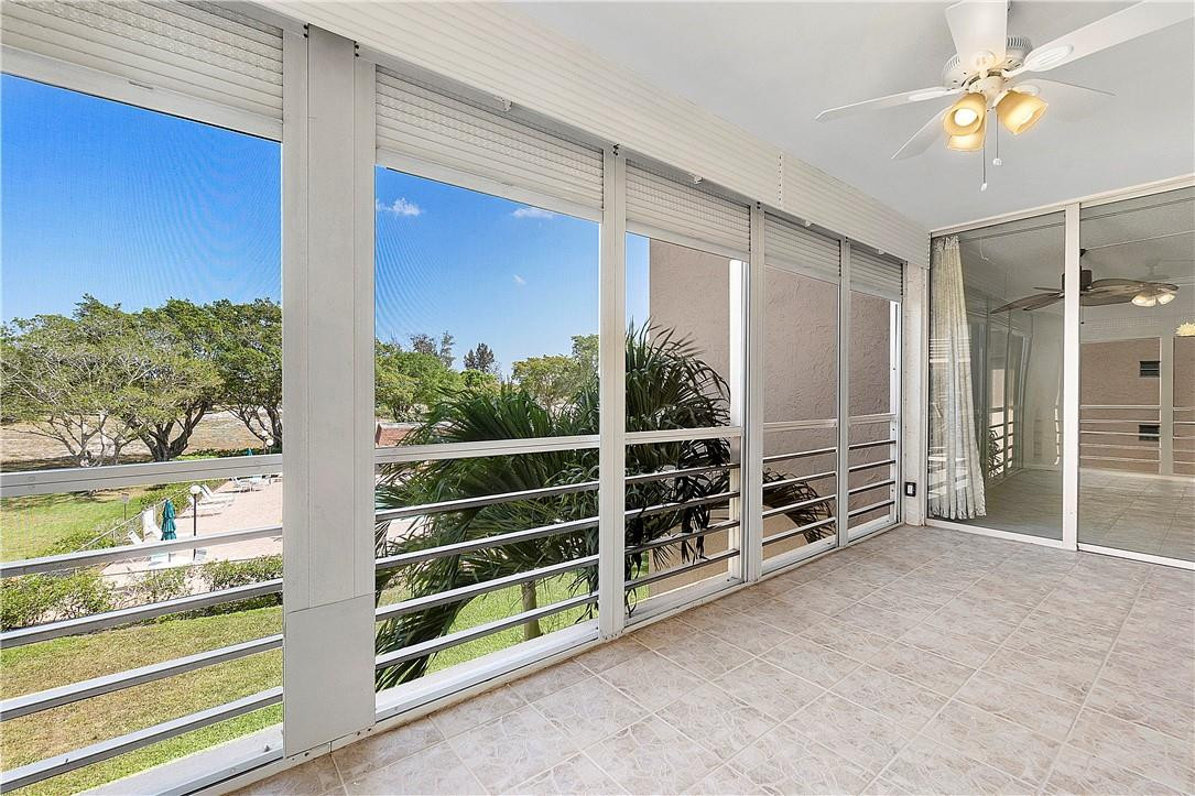 6100 Northwest 2nd Avenue, Unit 321 Boca Raton, FL 33487 - Photo 25 of 27 a view of an empty room with a fireplace and windows