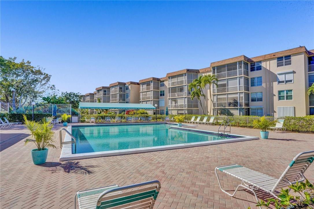 6100 Northwest 2nd Avenue, Unit 321 Boca Raton, FL 33487 - Photo 27 of 27 a view of swimming pool from a terrace
