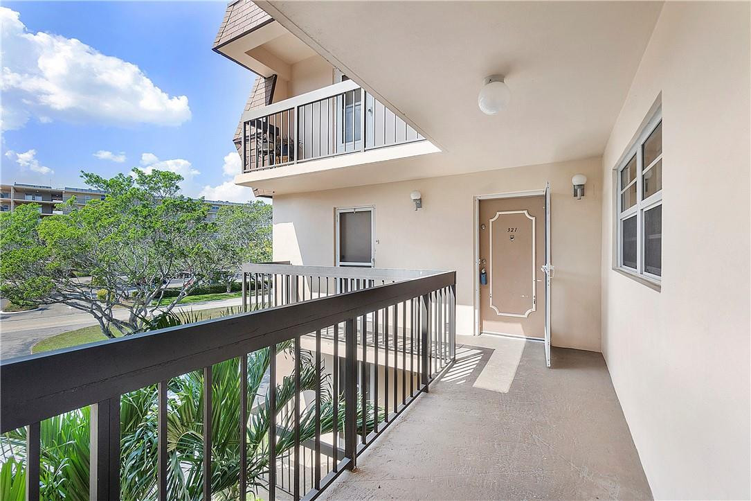 6100 Northwest 2nd Avenue, Unit 321 Boca Raton, FL 33487 - Photo 3 of 27 a view of a house with a balcony